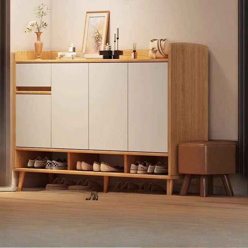 

Solid wood corner shoe cabinet at the entrance of home locker is integrated against wall
