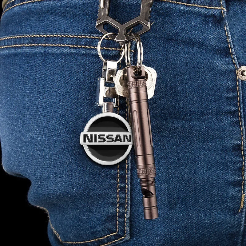 พวงกุญแจโลหะ 3 มิติ รูปโลโก้รถยนต์ อุปกรณ์ตกแต่งภายในรถยนต์ สำหรับ Nissan Nismo 370Z GTR Almera Tiida Juke Teana Qashqai 350Z