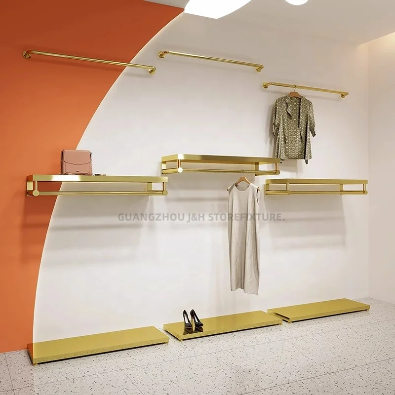 

customized.Simple design garment display racks stainless steel wall mount clothing rack clothing store display stands