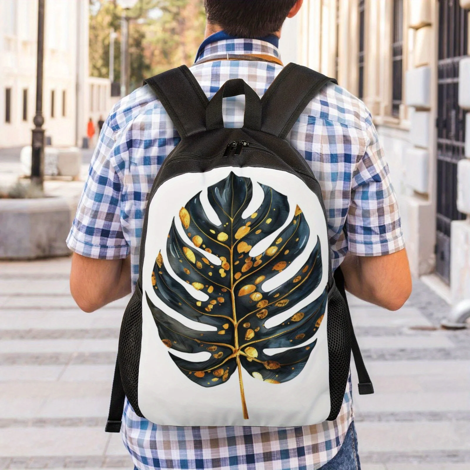 A black backpack with gold dot leaf print suitable for both men and women, perfect for high school and college backpacks