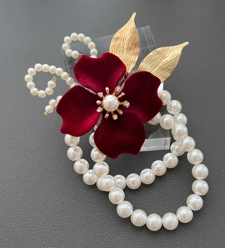 High-end design bridal wrist corsage with velvet rose and metallic wrapping wedding ribbon; bridesmaid and maid of honor floral