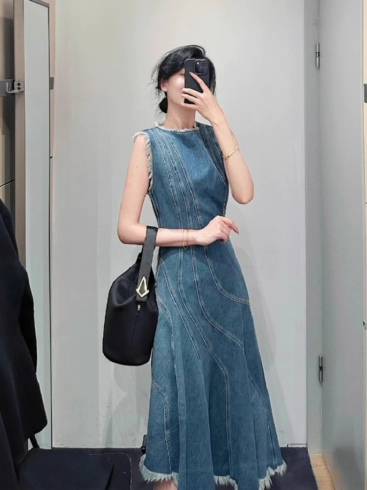 กระโปรงยีนส์สีน้ำเงินสไตล์วินเทจ แต่งผ้าปะติดปะต่อ ทรงเอวสูง ช่วยพรางหุ่น สไตล์เกาหลี เหมาะสำหรับใส่ไปเที่ยวทะเลหรือไปทำงาน  ฤดูใบไม้ผลิ 2025