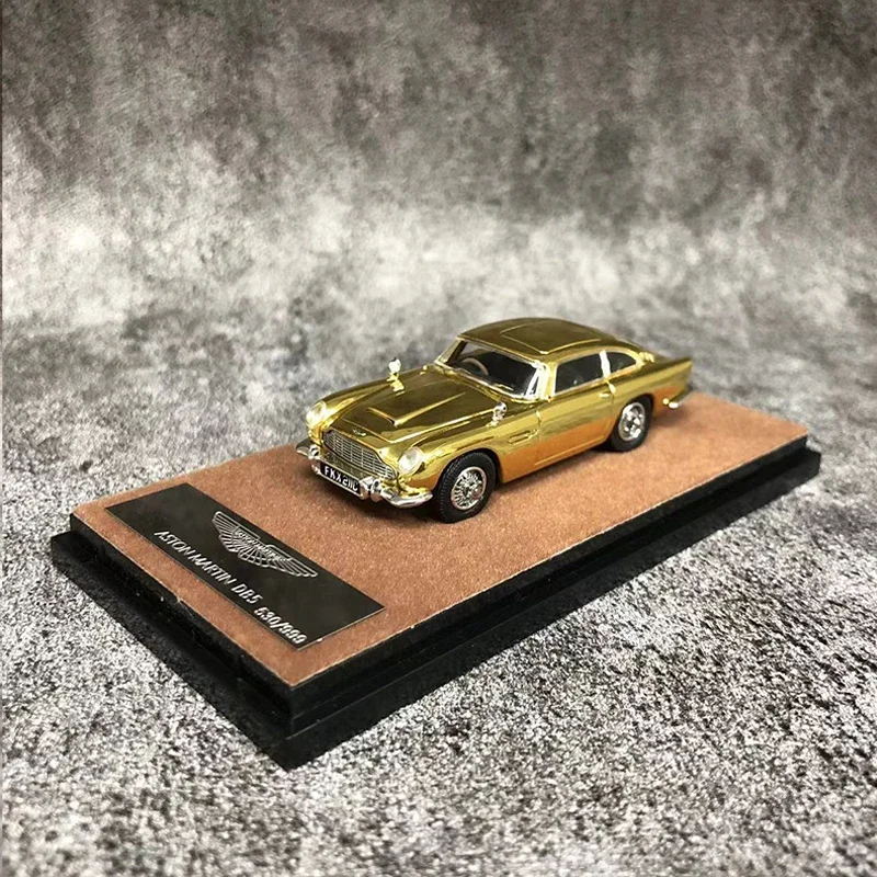 

Модель автомобиля Xiaoguang 1:64 Мартин DB5 литье под давлением-Golden Version LTD 999