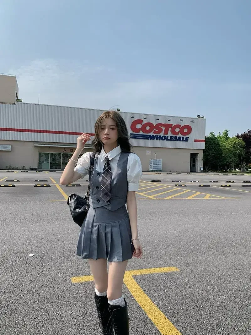 2025 été nouvelle mode femmes corée uniforme style jk robe ensemble gilet chemise courte plissée a-ligne jupe trois pièces jk ensemble