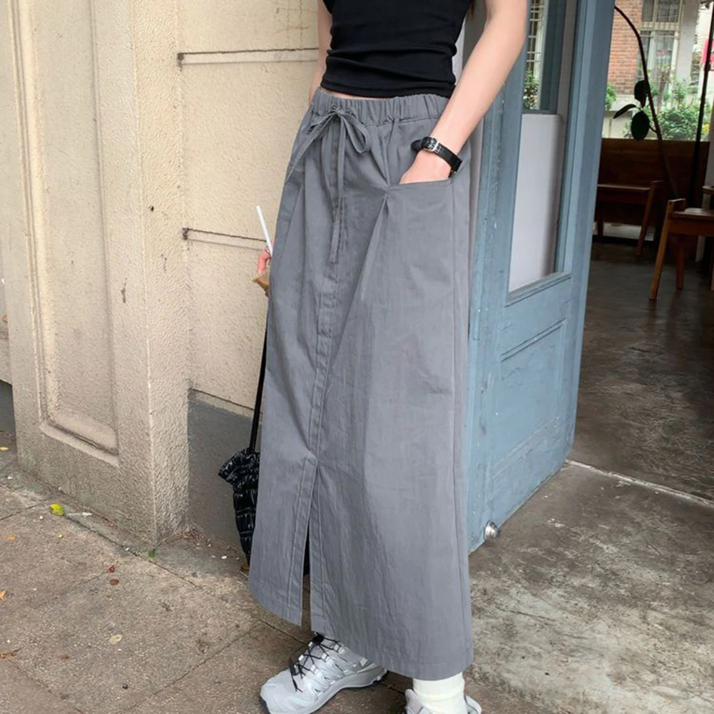 

Стильная женская рабочая юбка с разрезом и высокой талией и карманами, подходящая для повседневного использования и праздничного образа в различных оттенках