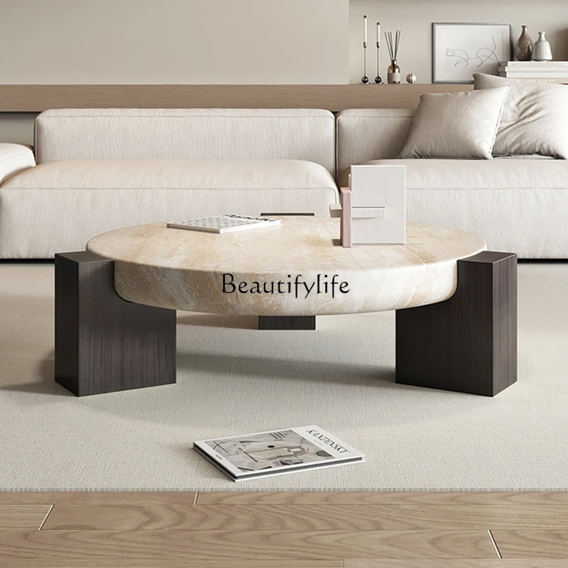 

Cream wind tunnel stone coffee table round light luxury high-end living room home