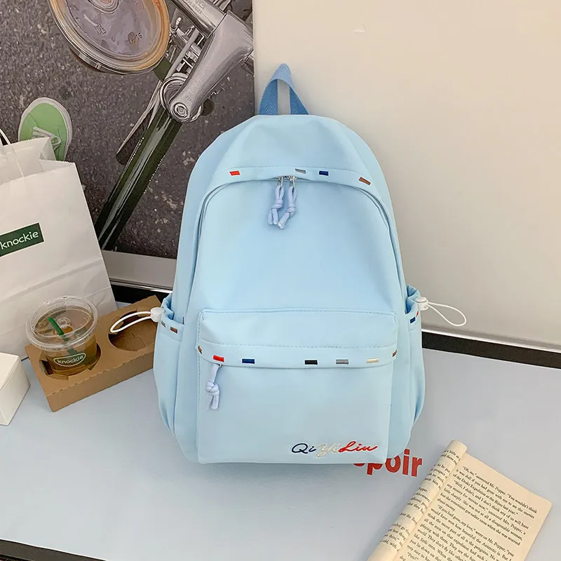 Korean-style cartoon backpack for female middle and high school students, stylish and large-capacity, versatile casual backpack