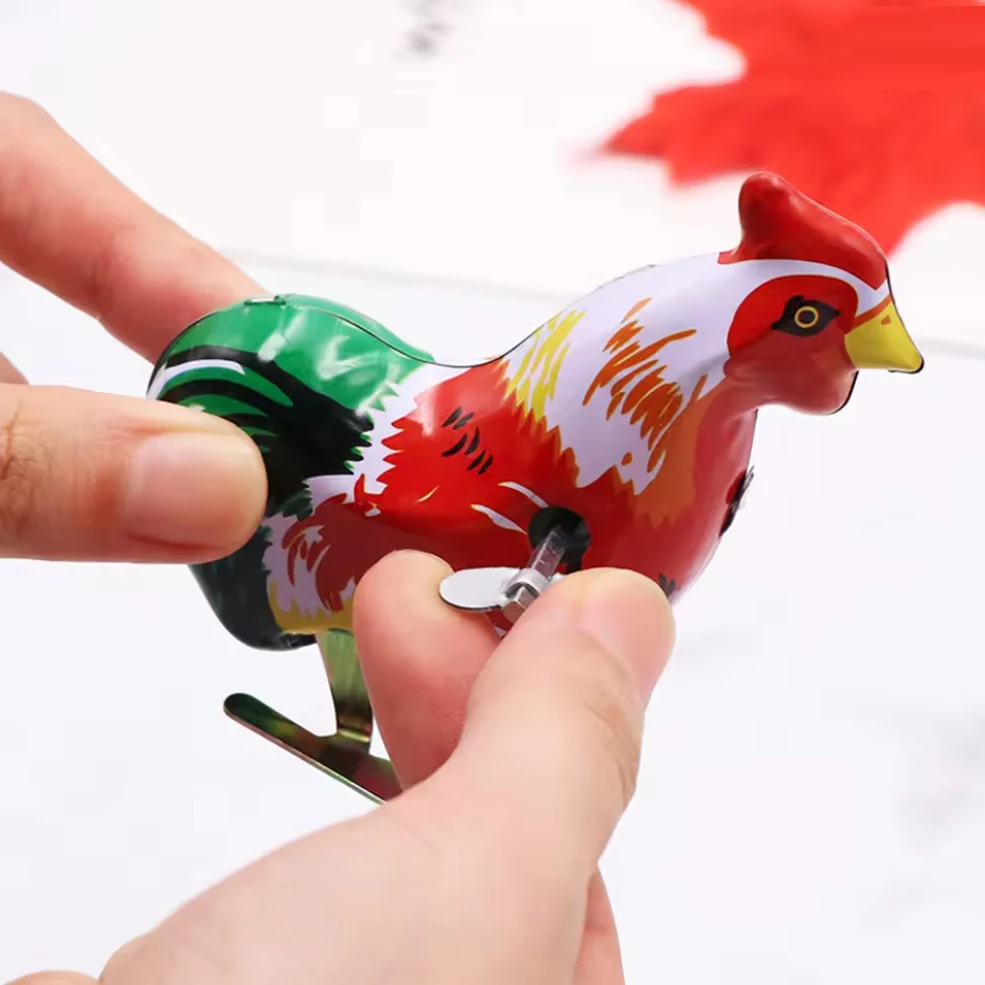 This is a classic spring jumping iron rooster children's toy, action doll children's toy, and children's classic spring toy gift