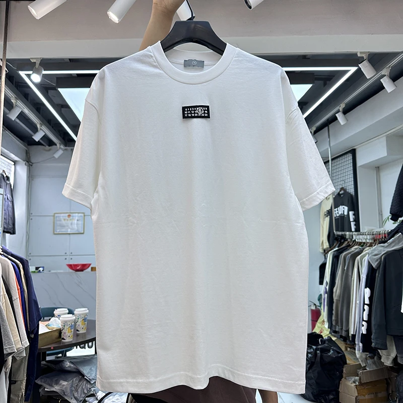 

Summer 2024 Loose Fit round Ne ort Sve T-irt ex Casual American High Street Sle Digital Logo Youth Faion