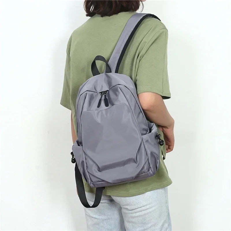 Mini zaino da uomo Borsa da scuola a tracolla nera piccola moda per uomo 2024 Zaini da viaggio sportivi impermeabili di design in tela