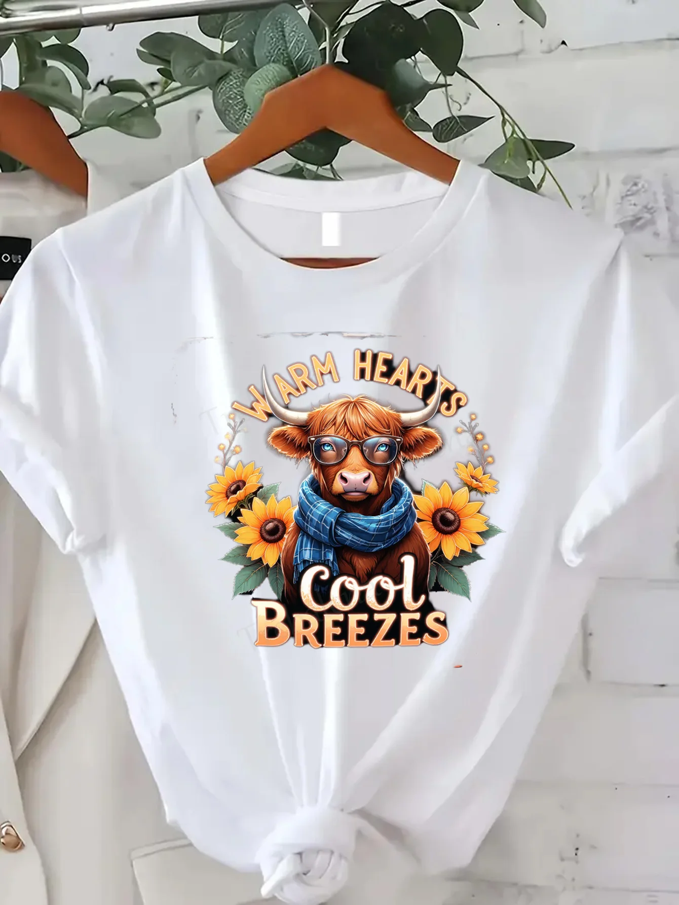 

Comfortable Women's Print T-shirt "Cute Highland Cow T-Shirt with Sunflowers: Warm Hearts Cool Breezes"