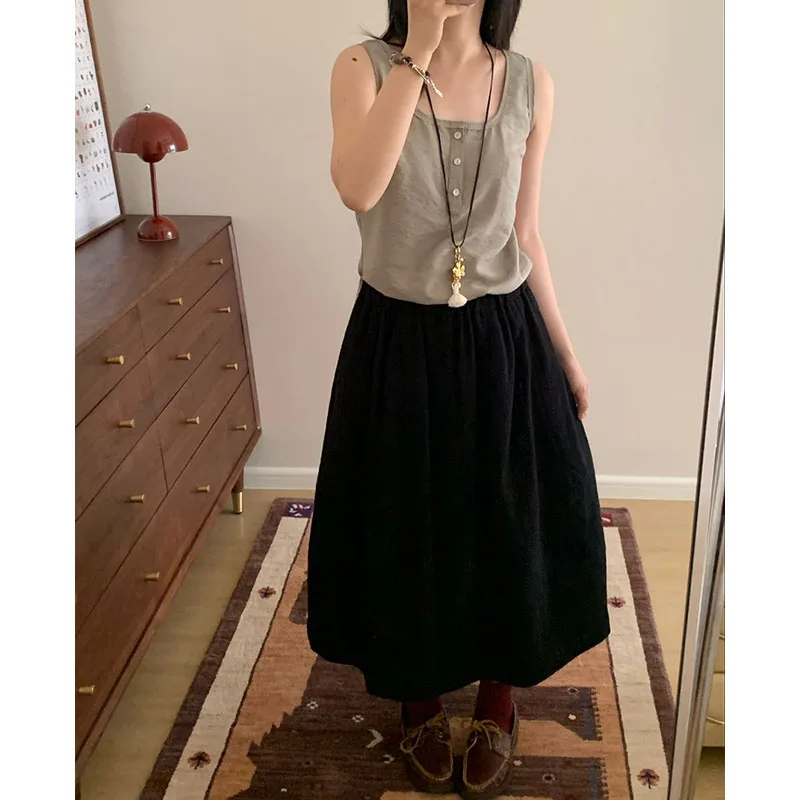 Falda de paraguas versátil ~ Tela Jacquard de lana 100% Otoño e Invierno Nuevo producto 2025 Media falda Falda negra Falda de capullo de flor alargadora de piernas para mujer