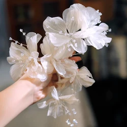 Original fairy gentle milk tea color flower crystal ear hanging bridal morning gown Joker flower earrings accessories.
