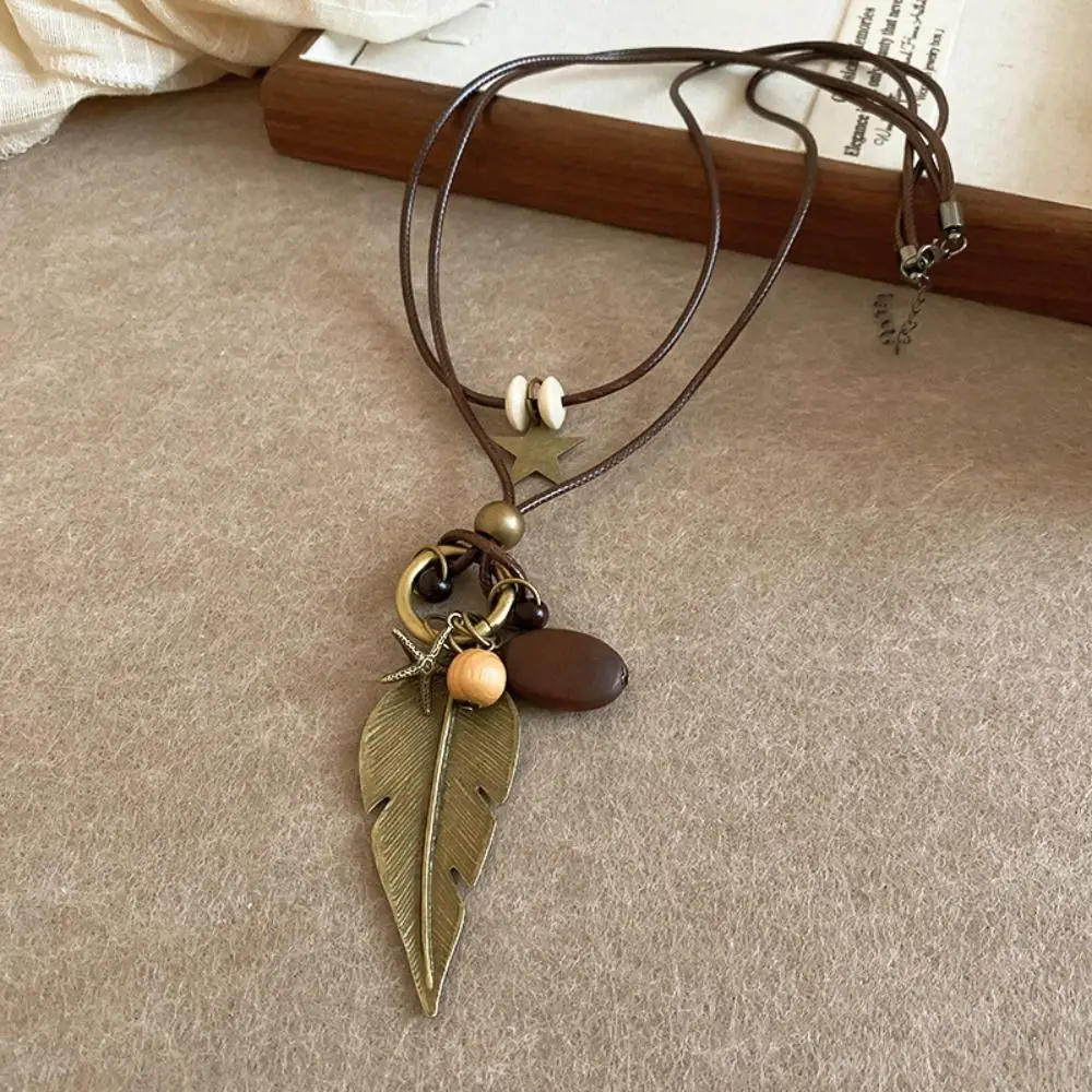 

Elegant Tassel Ethnic Style Necklace Geometric Pu Rope Bohemian Style Choker Leaf Feather Long Sweater Chain Decoration
