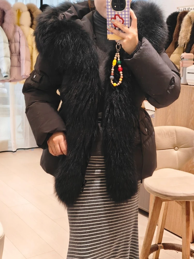 Women Winter Fur Coat Voluminous Raccoon Fur Hood Belted Waist Pockets Zipper Oversized Outerwear for Cold Climate Street Style