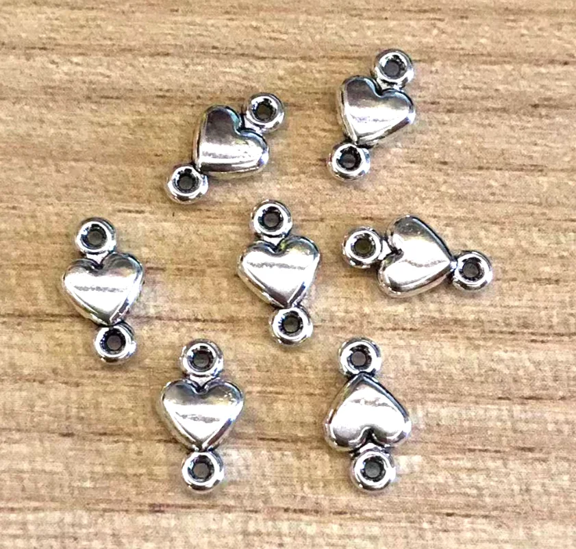 

50 шт. 10x5 мм сплав металла милый разъем в форме сердца HWH063