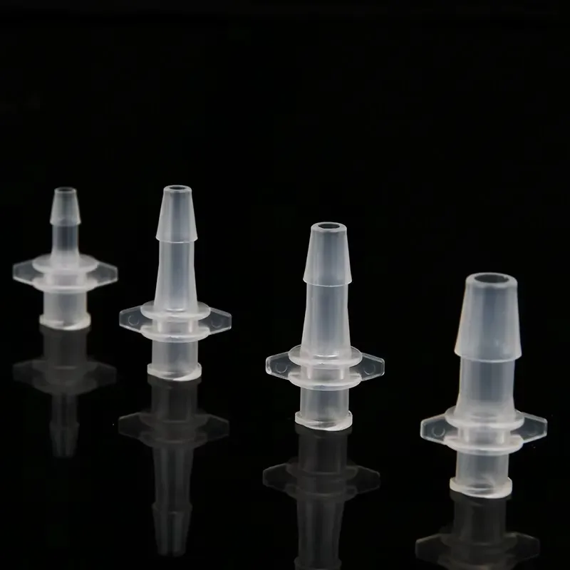Panel mounted baffle fittings for silicone tube basic fittings in fluid systems
