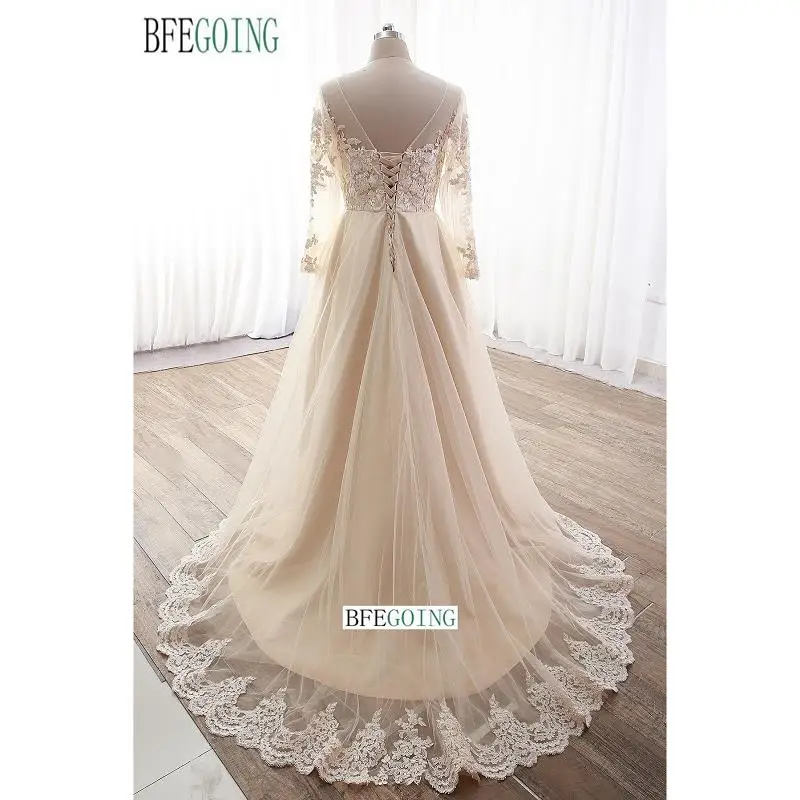 Appliques di pizzo Champagne Tulle maniche lunghe a-line abiti da sposa cappella treno abiti da sposa con scollo a v su misura