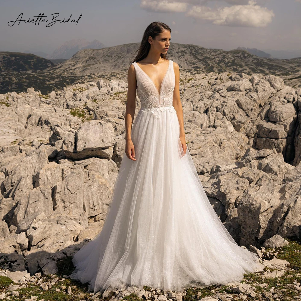 

Arietta Glitter Tulle Beach Wedding Dresses Deep V-Neck Sleeveless Appliques A-Line Bride Dresses Backless Boho Bridal Gowns