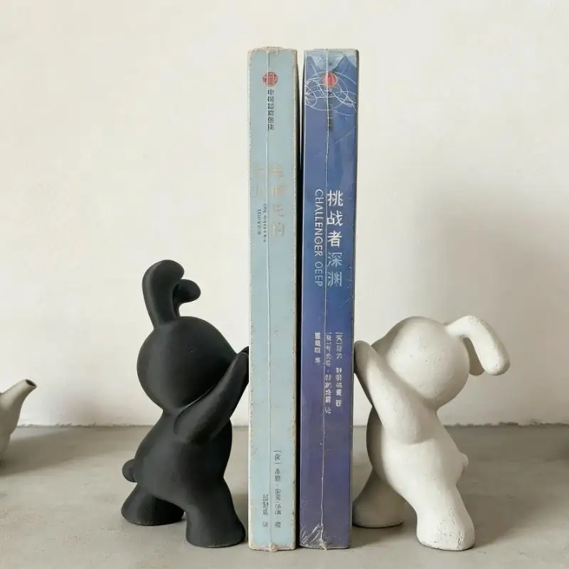 A pair of adorable black and white bunny bookends, decorative bookends for bookshelves, creative animal-shaped bookshelf clips.