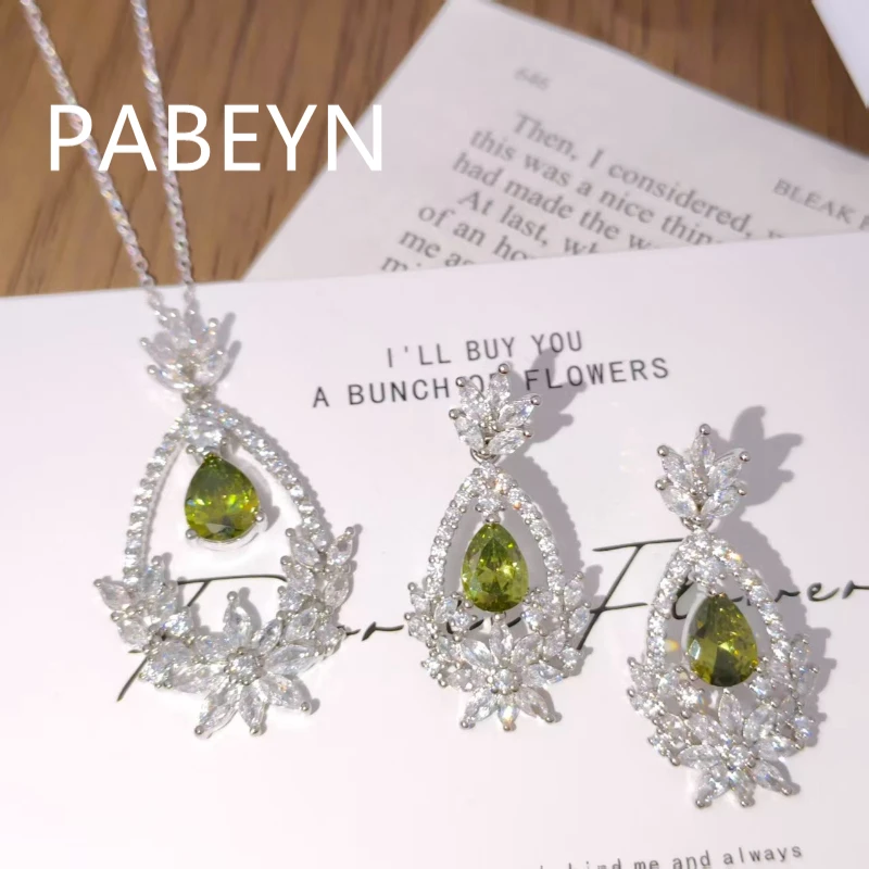 925 Silver Set. Red Pear Zircon, Delicate Leaf Details. Elegant Pendant and Earrings. Sophisticated Women's Jewelry.