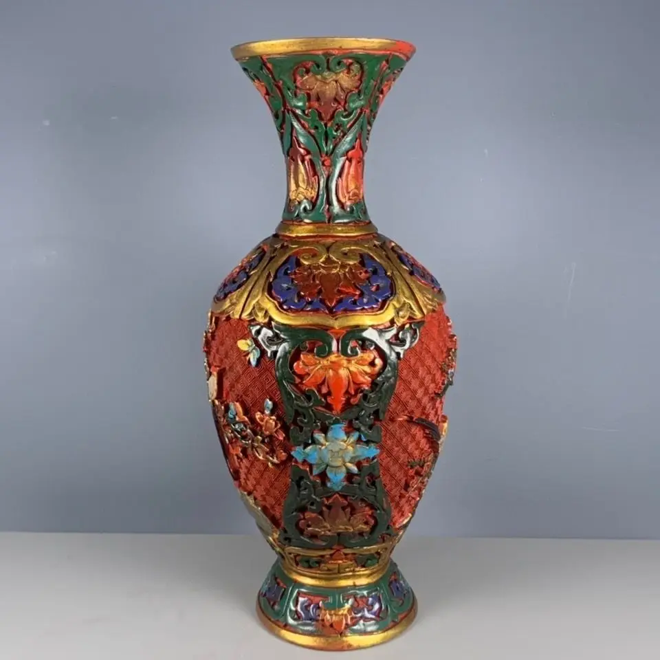 A reproduction of a Qing Dynasty Qianlong period lacquerware and hand-painted flower-and-bird vase ornament