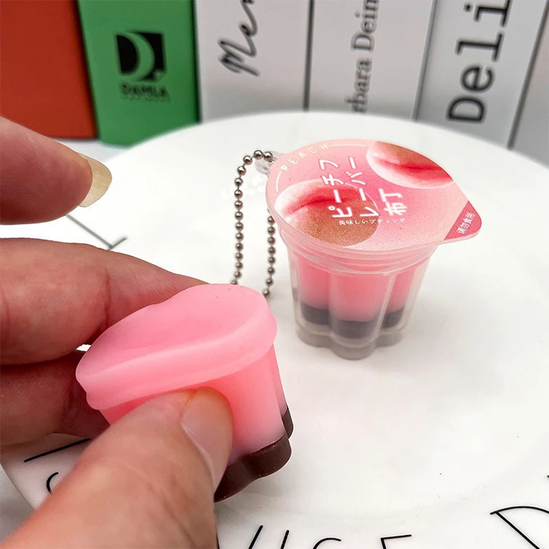 Morbido NUOVO Giocattolo Agitarsi Novità Budino Spremere Decomprimere Giocattolo Portachiavi Carino Alleviare Lo Stress Giocattoli Zaino Ciondolo Per Bambini Adulti Regalo