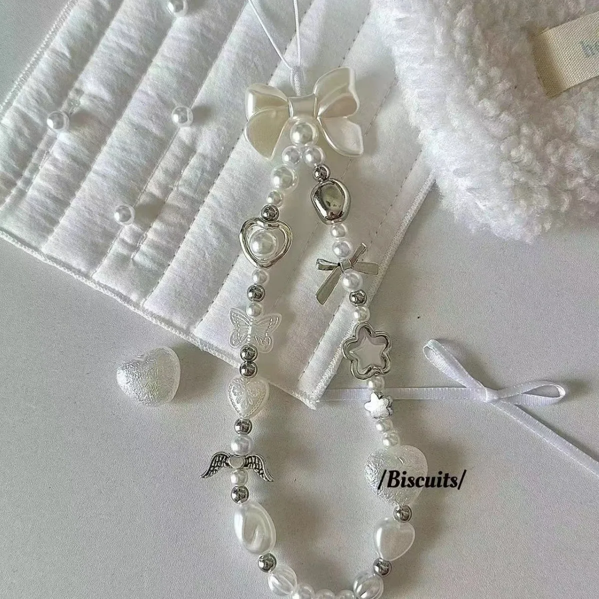 

Ins Style Домашняя жемчужная любовь Универсальная цепочка для мобильного телефона Роскошный подвесной светильник для мобильного телефона Pearl Advanced Ccd Подвесная камера