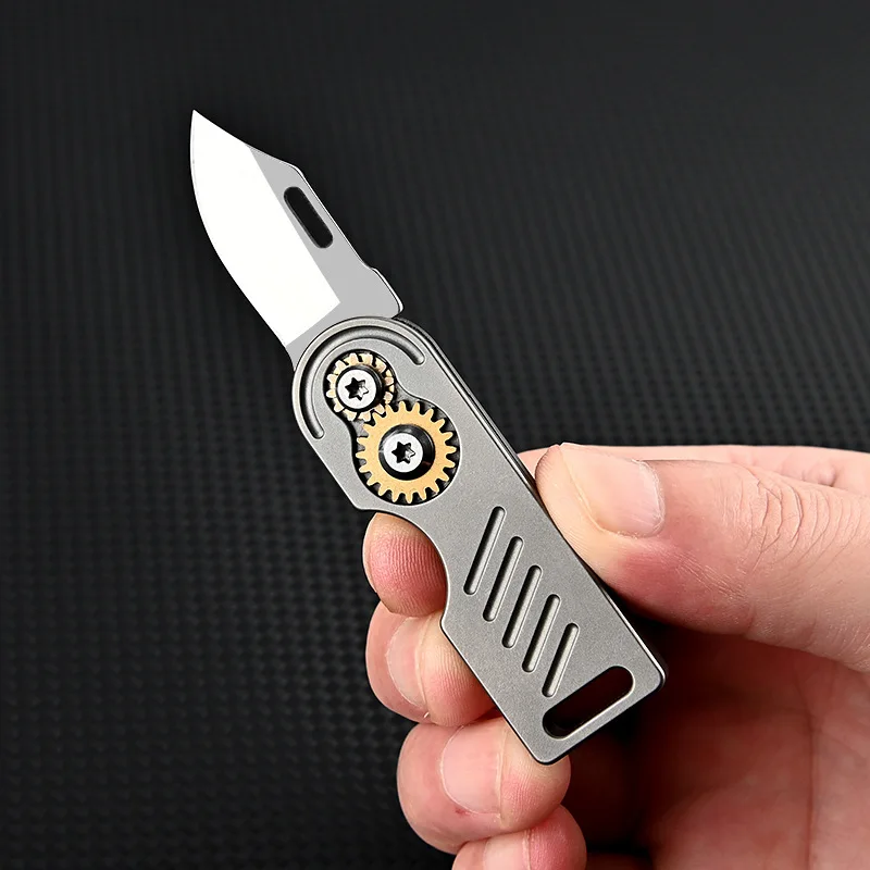 Titanium alloy folding knife creative gear keychain pendant fruit tool outdoor D2 steel sharp dismantling express delivery