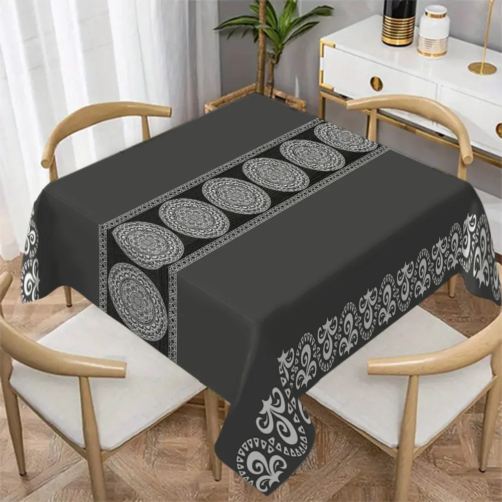 One rectangular tablecloth with a luxurious black and white floral print - made of durable polyester fabric.
