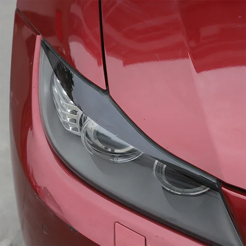 

2Pcs PVC black Headlight Eyebrows Eyelids For BMW 3 Series E90 E91 2005-2012 Stickers Car Accessories