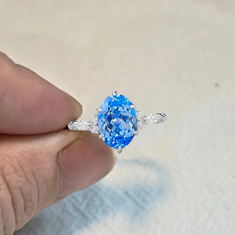 S925 Sterling Silver Ring 7*10mm Oval Cut Lab-Created Blue Gemstone Side Zircon Accent 6-Prong Setting Women Engagement Jewelry