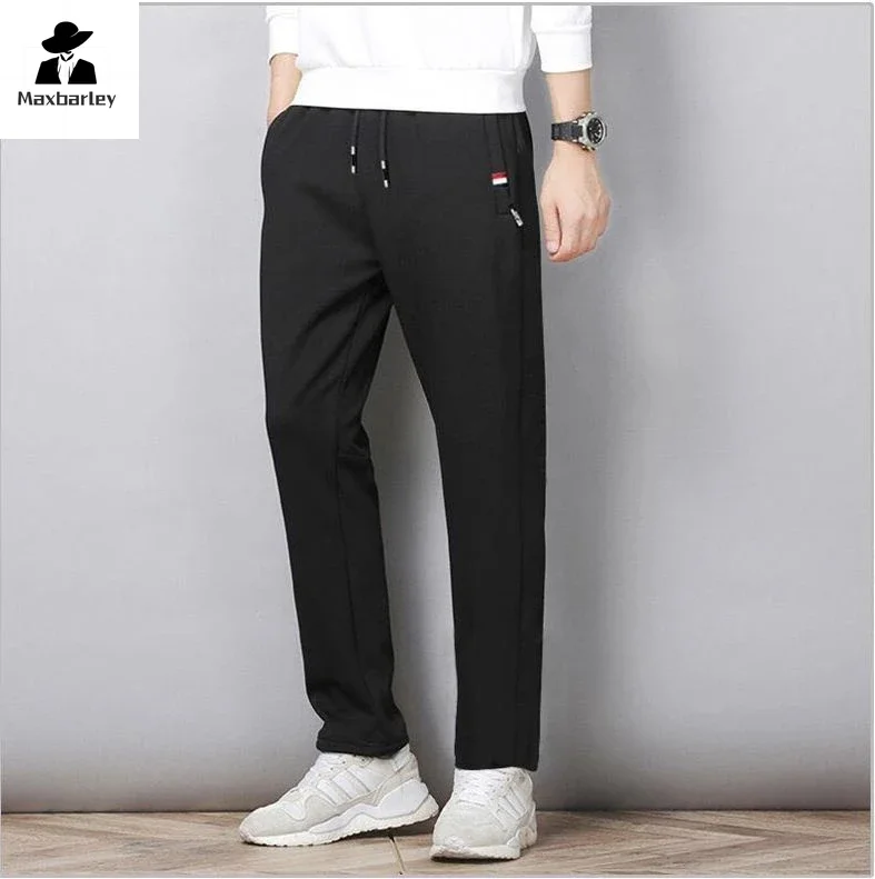 Pantaloni autunnali uomo Fitness abbigliamento sportivo tuta pantaloni sportivi elastici in vita pantaloni in cotone palestre larghe pantaloni