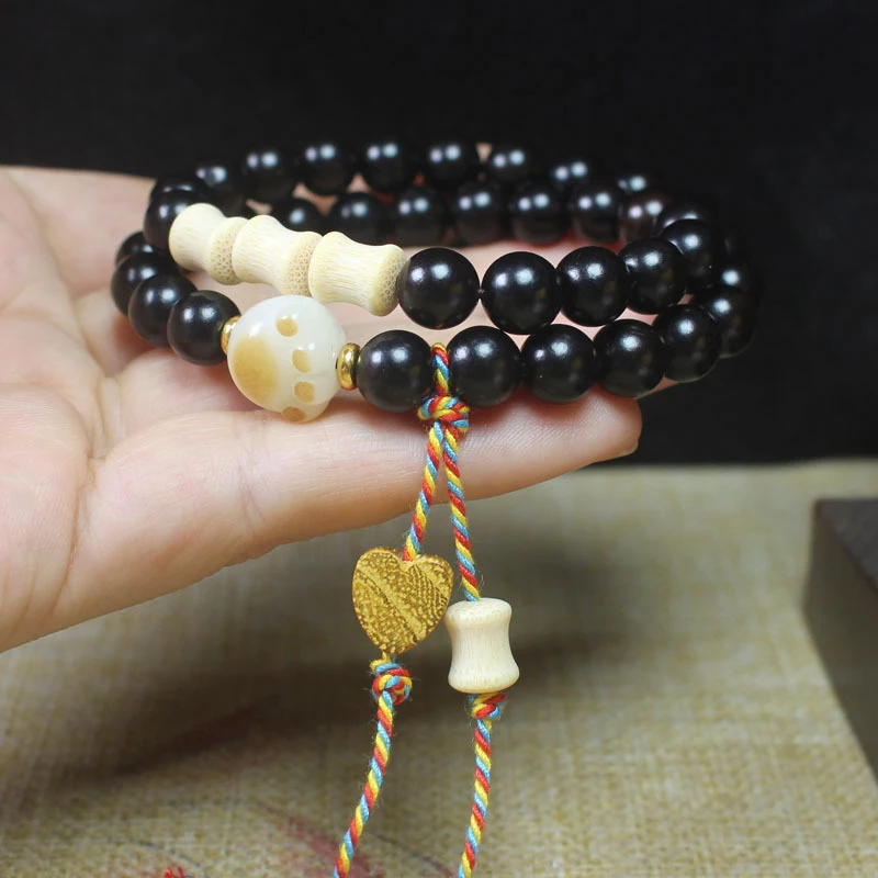 Ebony 8mm double-loop bracelet with heart-shaped tassels, unisex decorative accessory for cultural appreciation and meditation,
