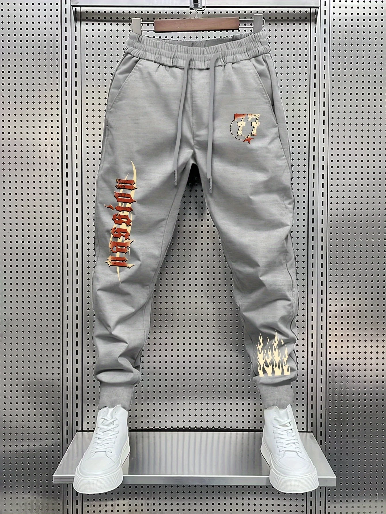 Hot street‑wear gothic lettering number77 burning flame side artwork print sweatpants men hip hop sports jogger trousers