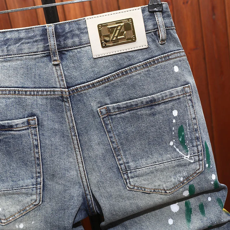Retro denim shorts for men, slim fit with ripped patches, spray painted prints, trendy street nostalgia denim five quarter pants