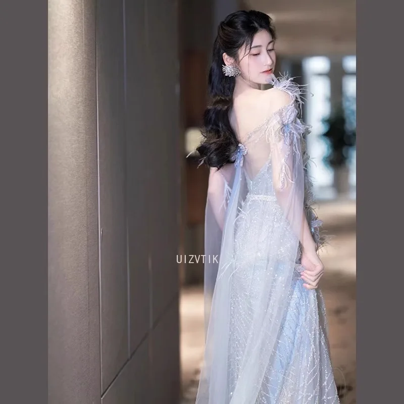 فساتين نسائية زرقاء طويلة لحفلات الزفاف أنيقة مزينة برقبة على شكل حرف v بدون أكمام من التل فستان سهرة فستان حفلات