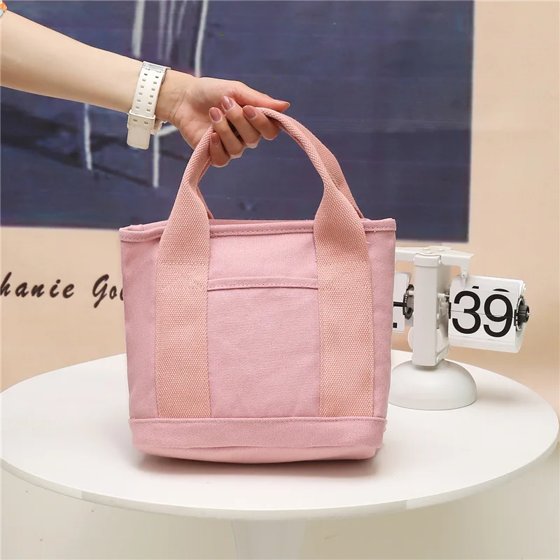 

The new canvas cosmetic bag handbag Japanese hand bag large lunch bag large capacity wash gargle to receive bag undertakes