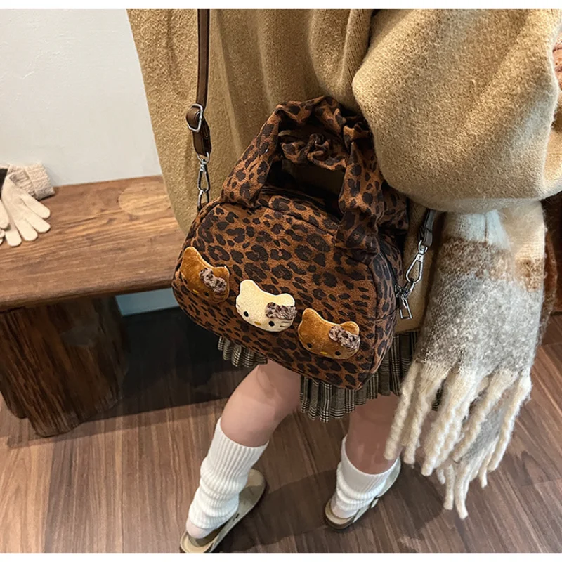 Sanrio hello kitty moda portátil bolsa feminina dos desenhos animados leopardo impressão boneca casual versátil simples bolsa de ombro mensageiro