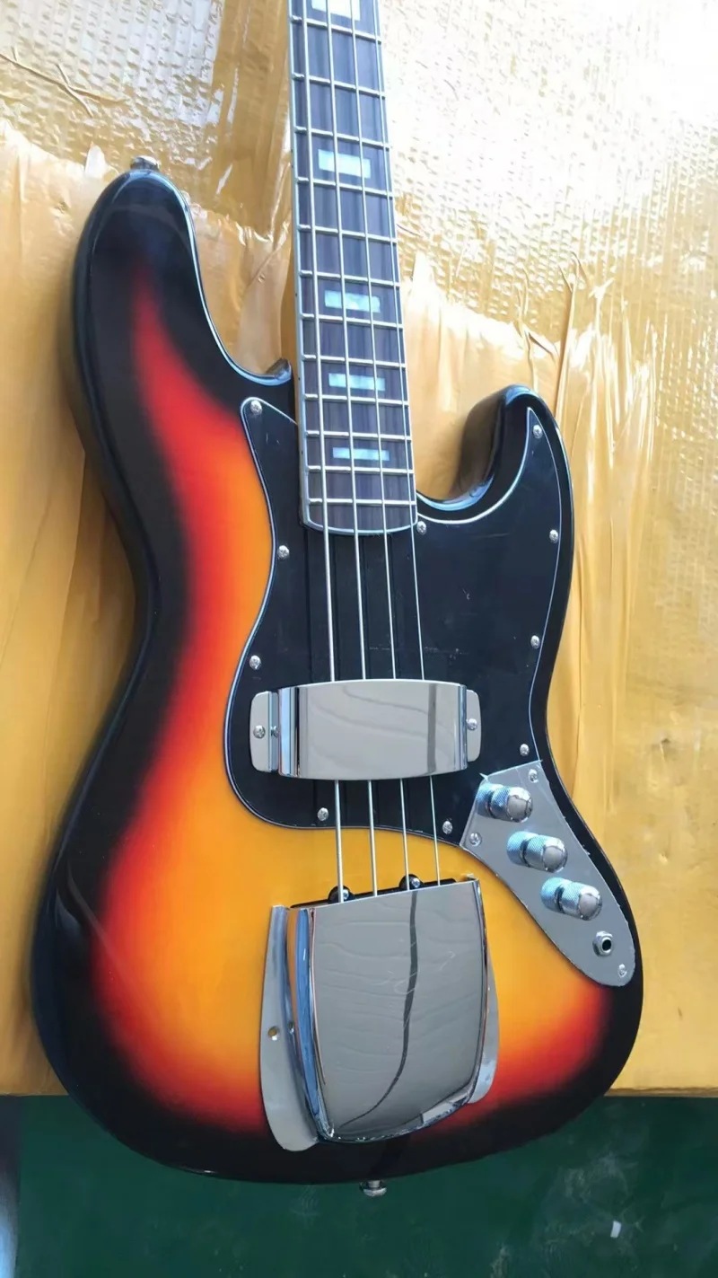 

In stock high quality 4 string electric bass,Rising sun body,Maple neck rose wood fingerboard,Solid wood quality,Free delivery