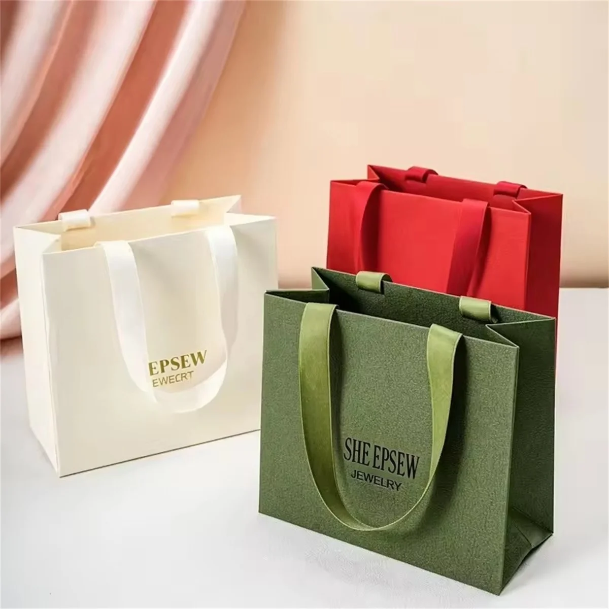 

24/50/100pcs Unique eco-friendly luxury cardboard gift bag with recyclable custom logo ribbon handle and gold stamp