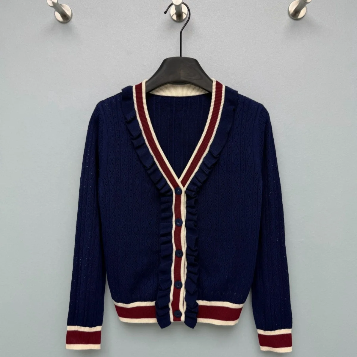 2026 high-quality women's black fungus edge contrasting hollow knitted cardigan--2026010257