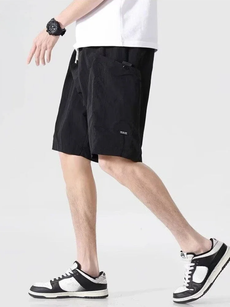 Celana Pendek Pria Bermuda dengan Saku Tali Tarik Celana Pendek Kargo Pria Setengah Panjang Solid Pakaian Vintage Pinggang Elastis Baru Dalam Lebar
