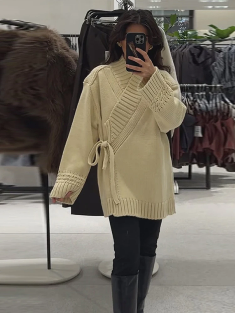 Aprikosenfarbener, einfarbiger, geschnürter Damen-Strickpullover mit V-Ausschnitt, langen Ärmeln, lässiger, modischer Cardigan für Frühling/Herbst 2026.