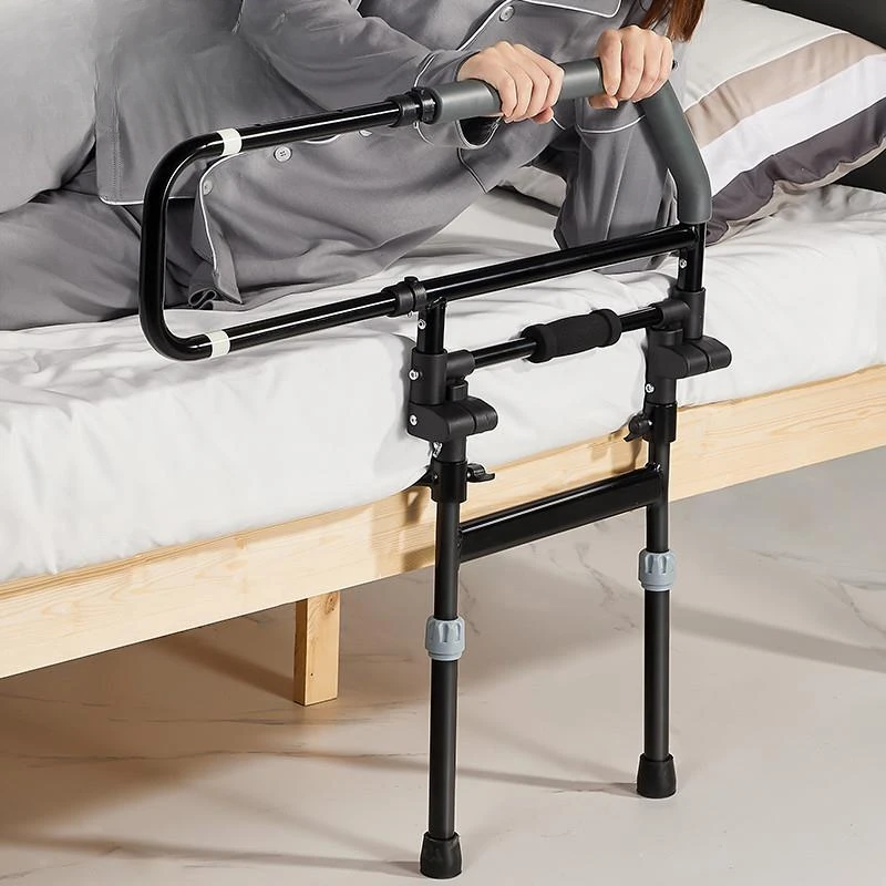 The elderly anti-drop handrail railing beside  bed can be folded to get up,  handrail frame is fixed at head of