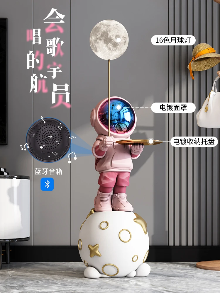 Astronaut decoration on the floor in the living room, astronaut lamp, decoration beside the sofa beside the TV cabinet