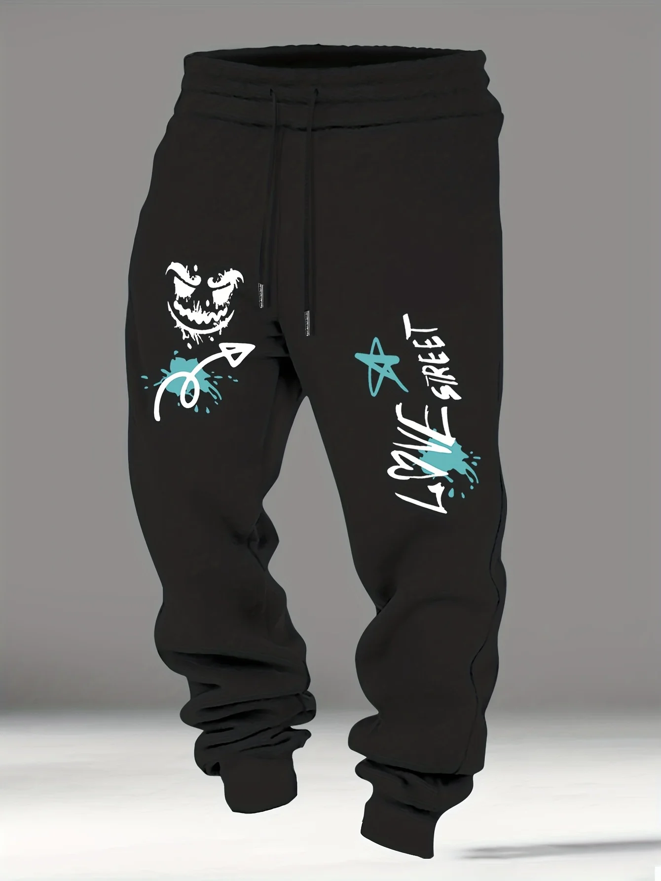 Splash‑ink street‑ghost face graffiti artwork stylish tapered fitted sweatpants men hip hop sports jogger trousers