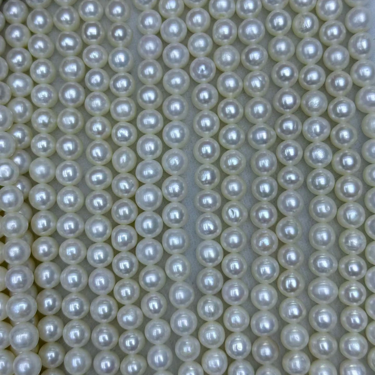 

Натуральные пресноводные жемчужины почти круглой формы 6.5-7.5 мм, россыпью, для изготовления браслетов, серег, ожерелий, оптом