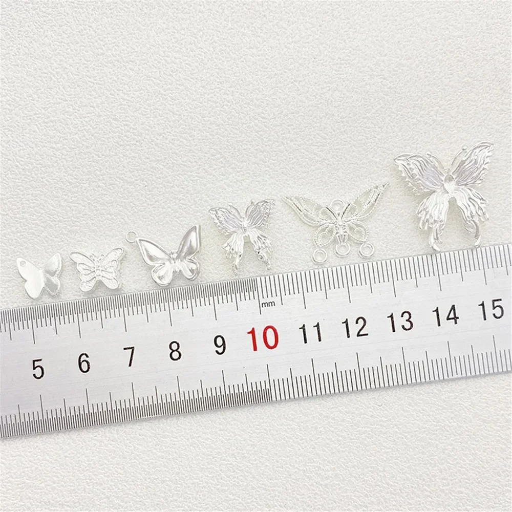 จี้รูปผีเสื้อสีเงินสดใส สร้อยข้อมือครึ่งวง ลูกปัดโลหะ ตัวเว้นระยะลูกปัด ทำด้วยมือ วัสดุทำสร้อยข้อมือ สร้อยคอ เครื่องประดับ