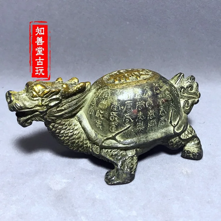 

Brass gilded longevity dragon turtle ornaments attract wealth and fortune. Copper ware collection and home decoration